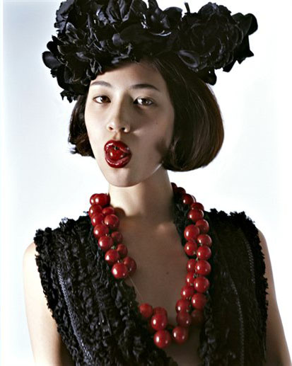 image of Kiko Mizuhara with fruit in the NYC Store's Holiday Campaign