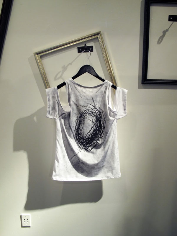 Image of exposed shoulder printed shirt by Shin Pop-Up Shop at Acrimony